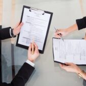 Tech recruitment services consultant reviewing candidate resumes