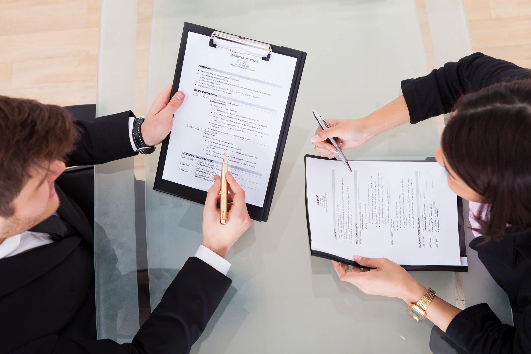 Tech recruitment services consultant reviewing candidate resumes
